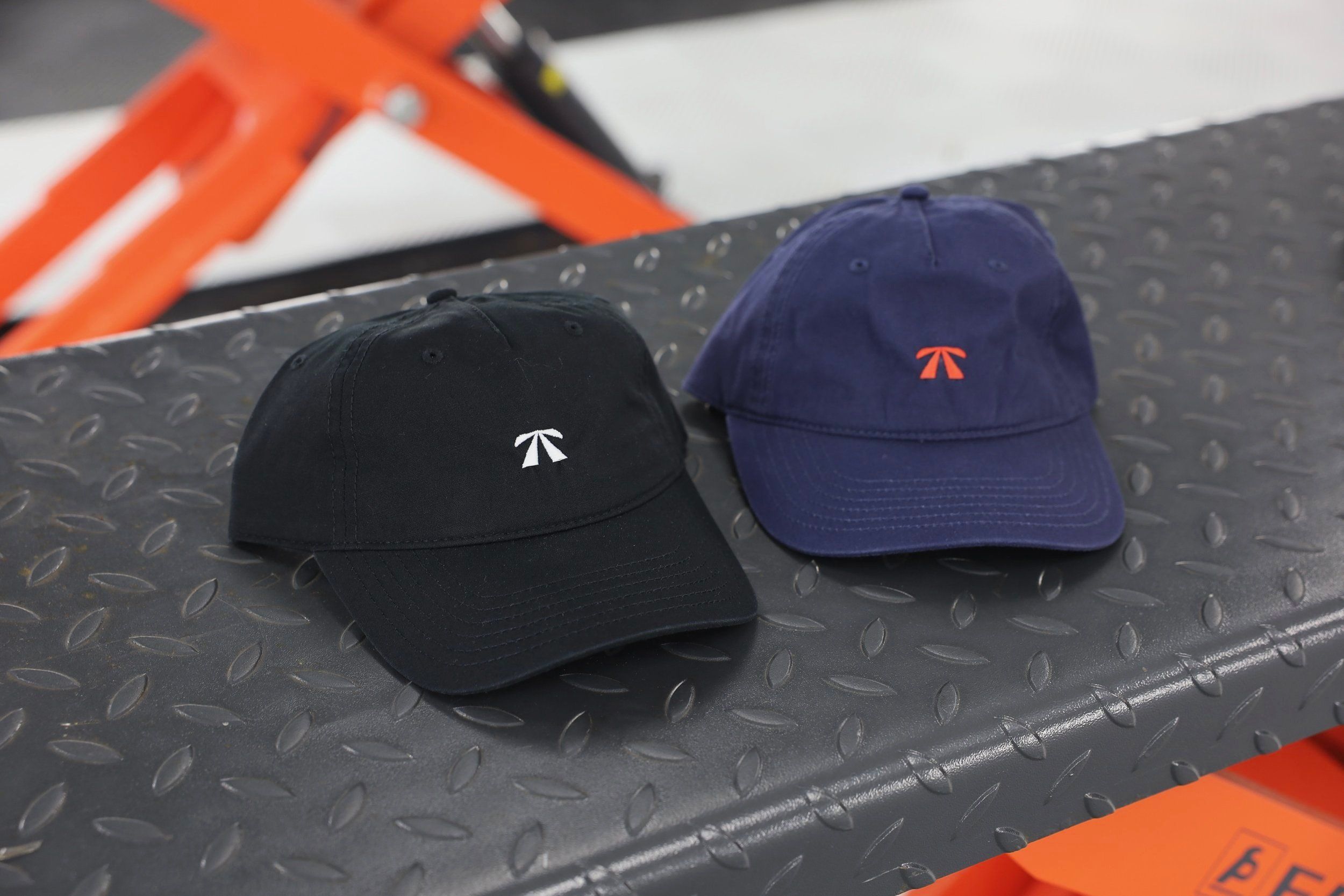 The RB Dad Cap by Roadbloc, in black and white or navy and orange