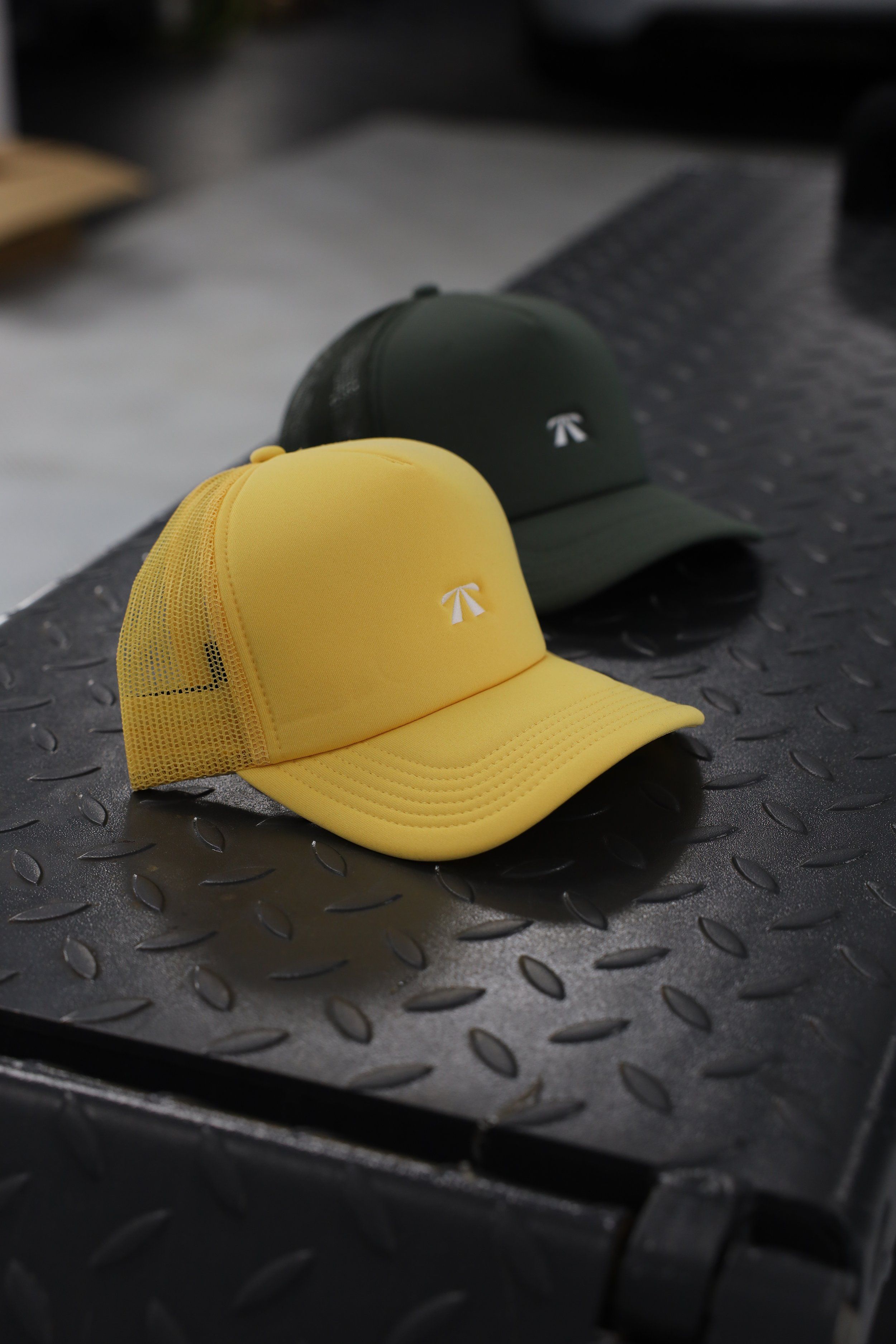 The Puff Trucker Cap by Roadbloc, in Cyprus Green and Sunset Yellow