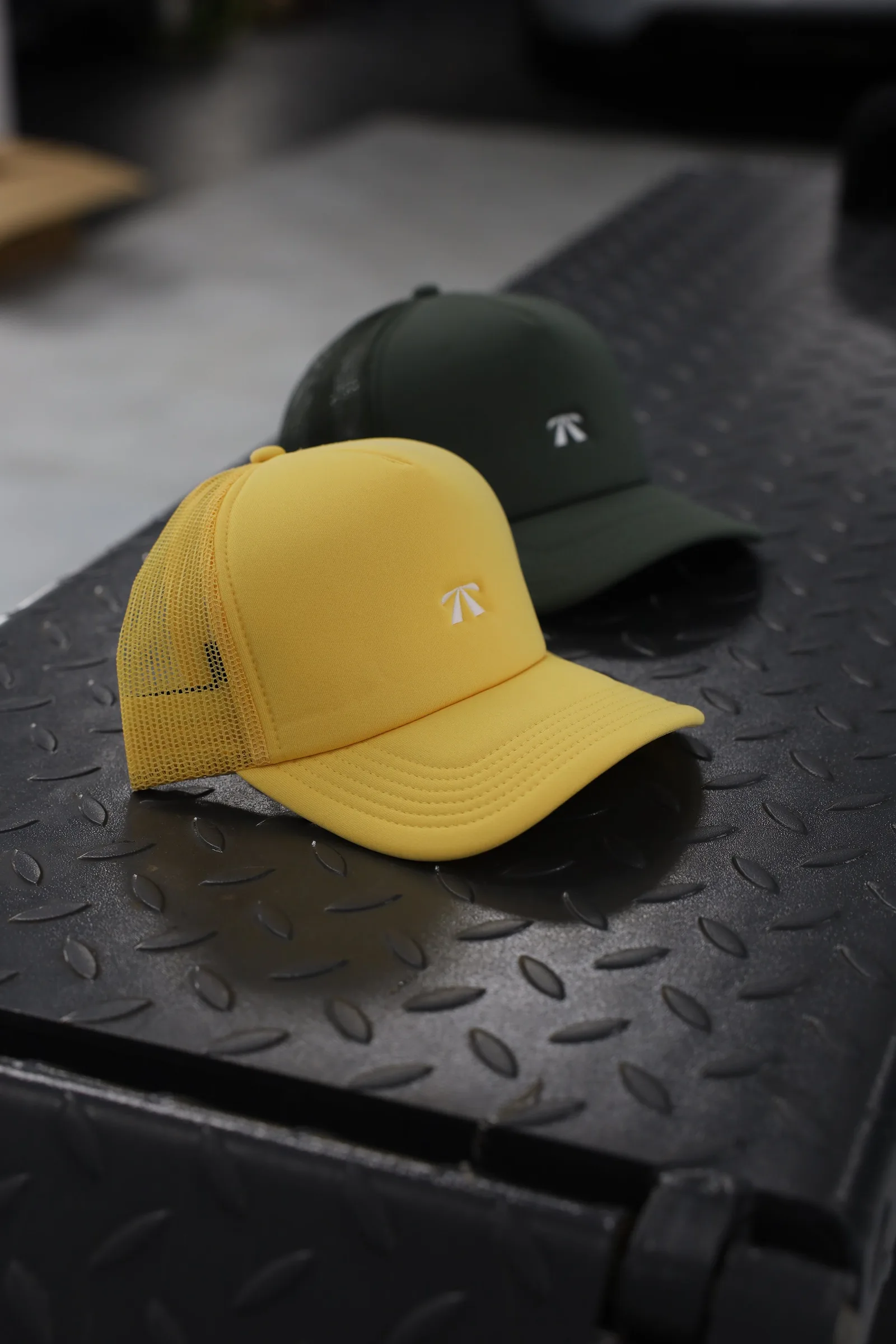 The Puff Trucker Cap by Roadbloc, in Cyprus Green and Sunset Yellow