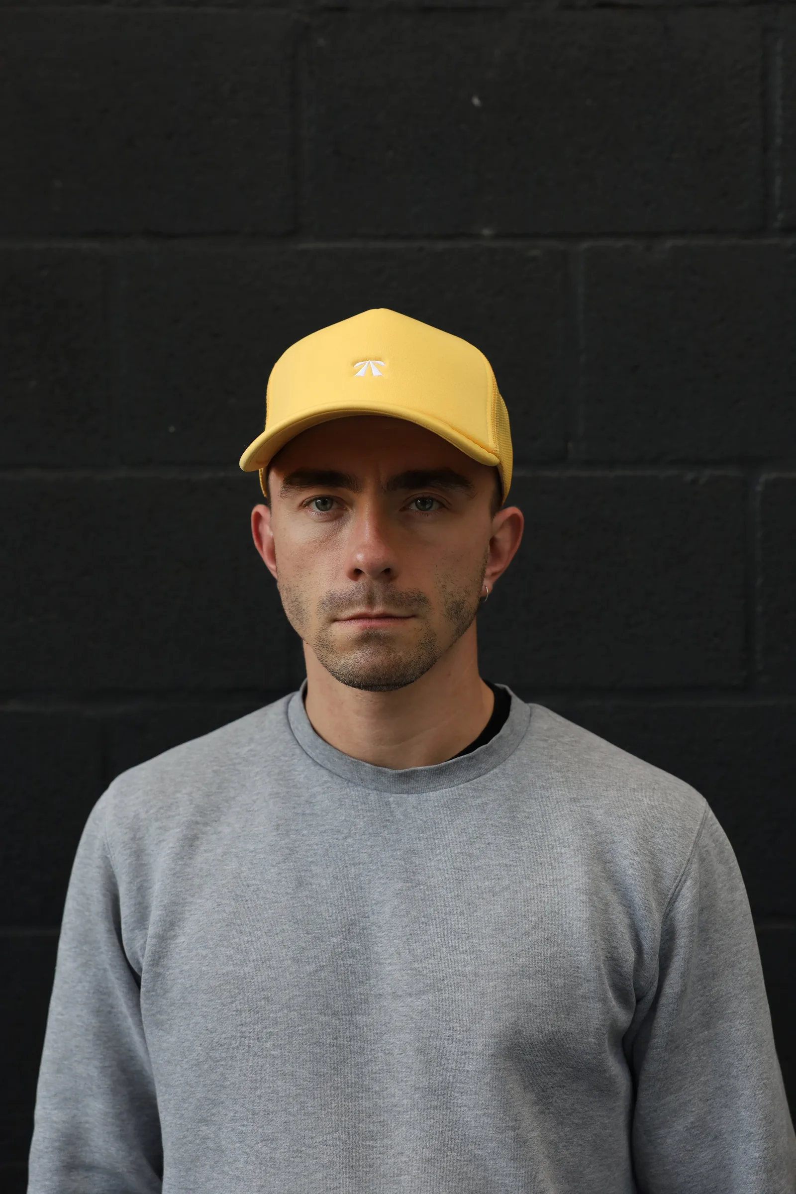 The Puff Trucker Cap by Roadbloc, in Cyprus Green and Sunset Yellow