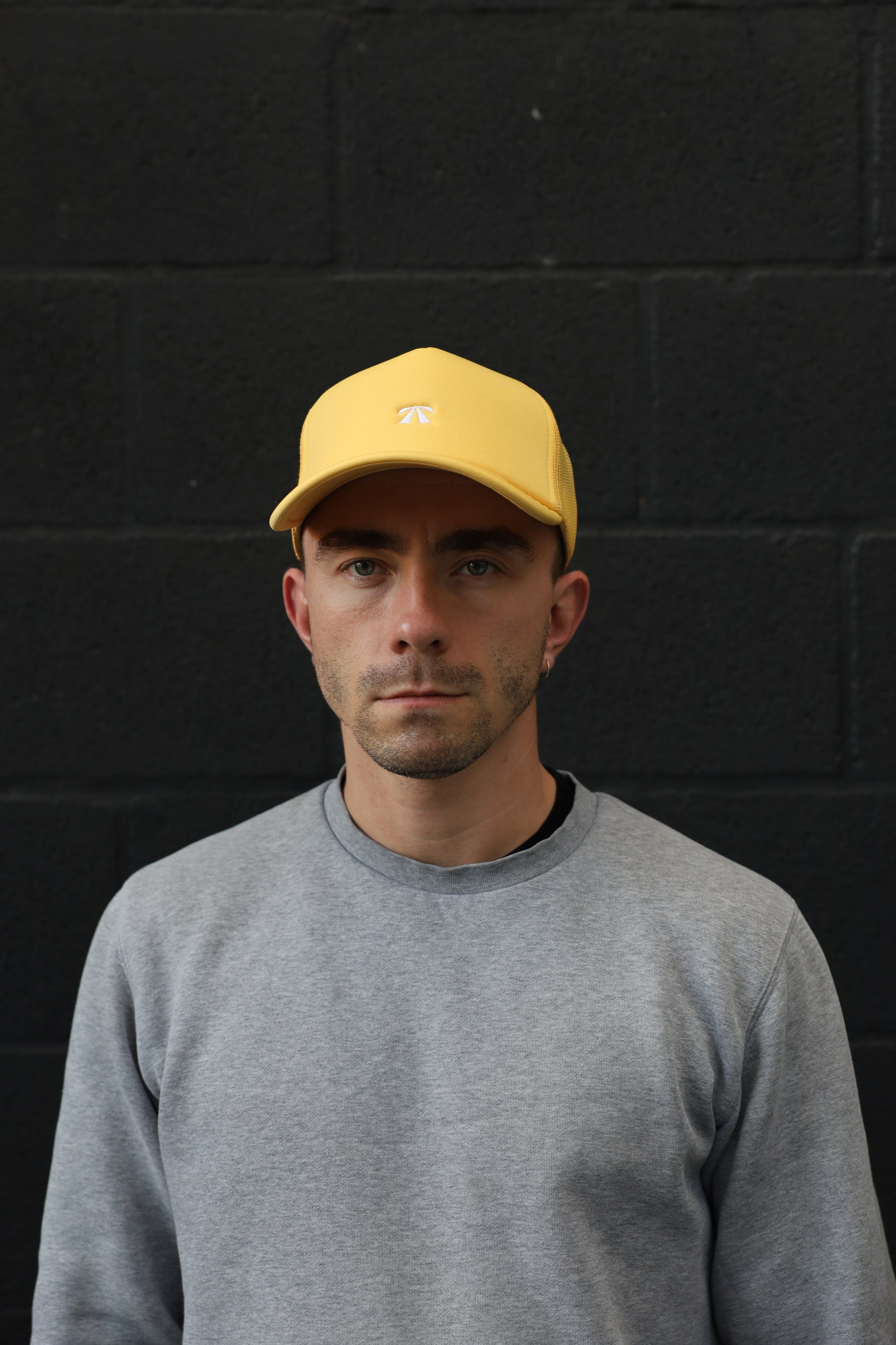The Puff Trucker Cap by Roadbloc, in Cyprus Green and Sunset Yellow