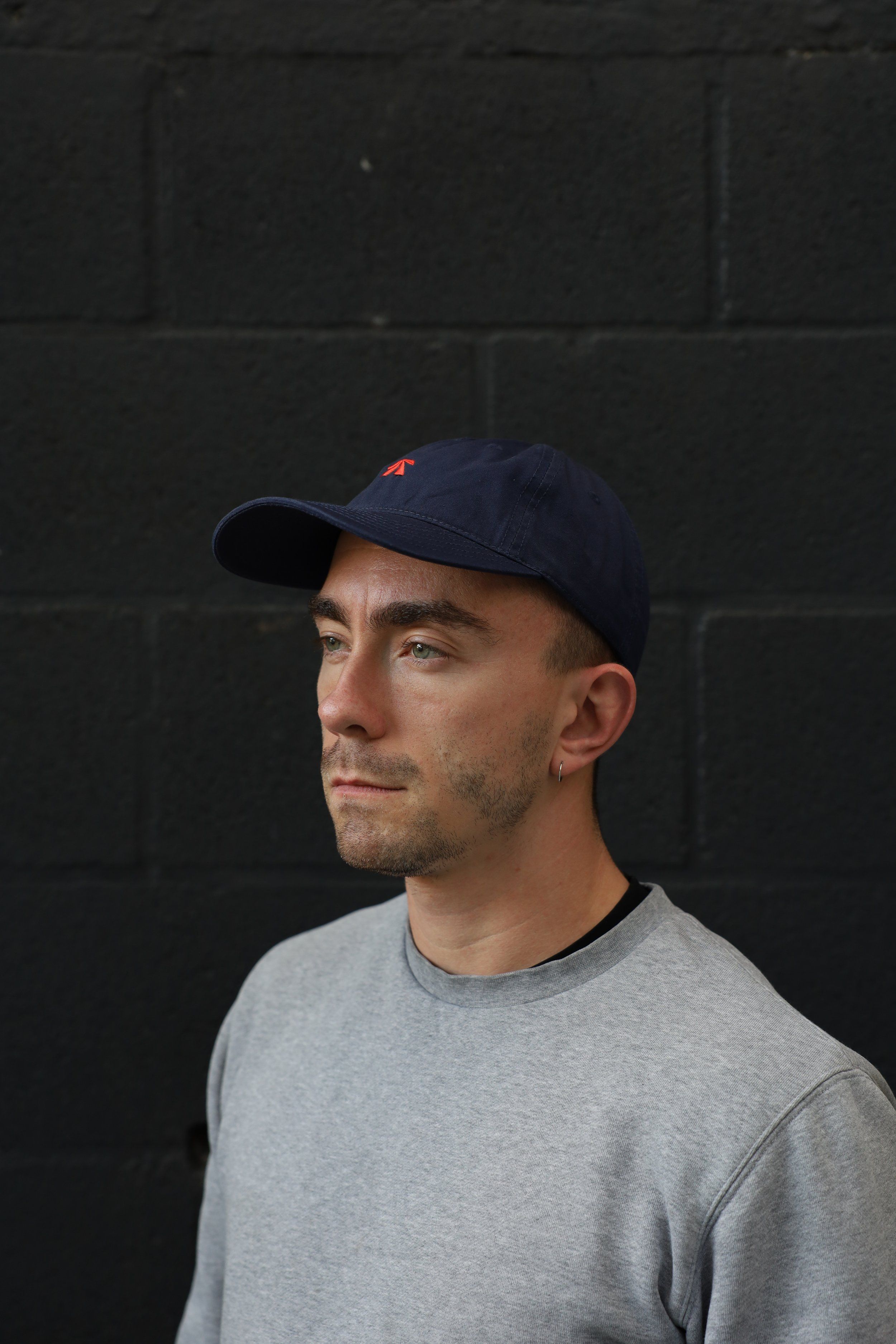 The RB Dad Cap by Roadbloc, in black and white or navy and orange
