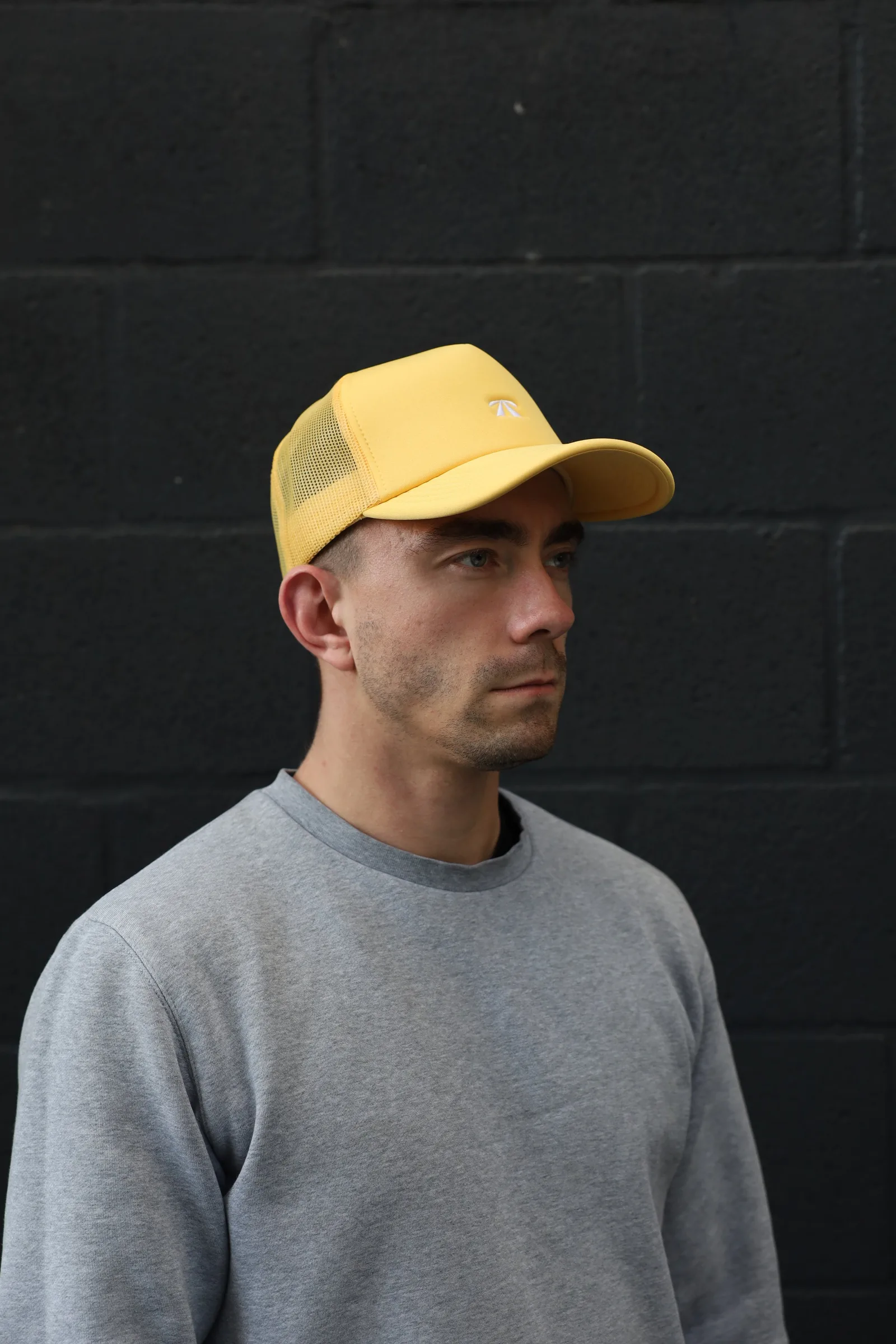 The Puff Trucker Cap by Roadbloc, in Cyprus Green and Sunset Yellow