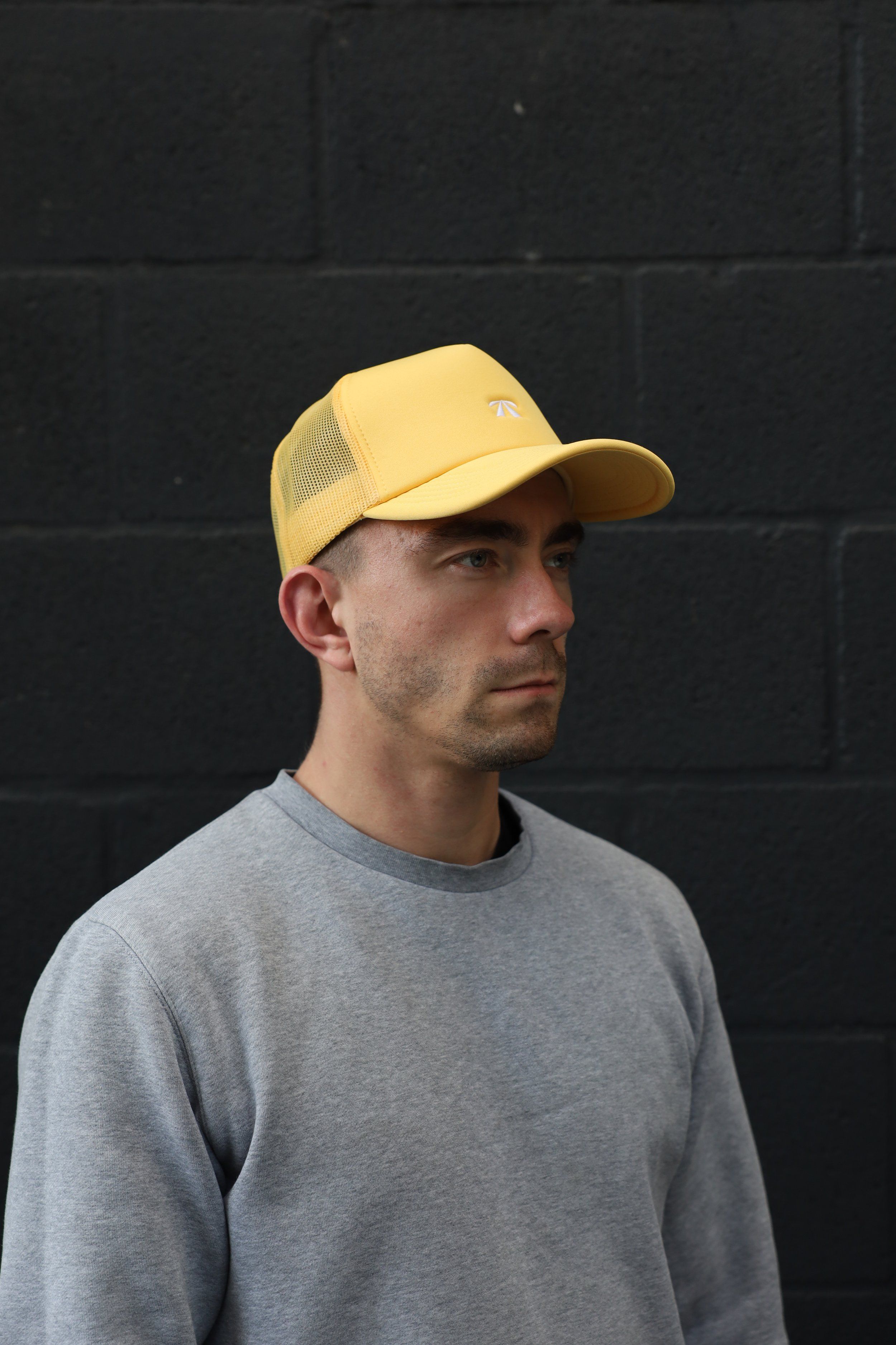 The Puff Trucker Cap by Roadbloc, in Cyprus Green and Sunset Yellow