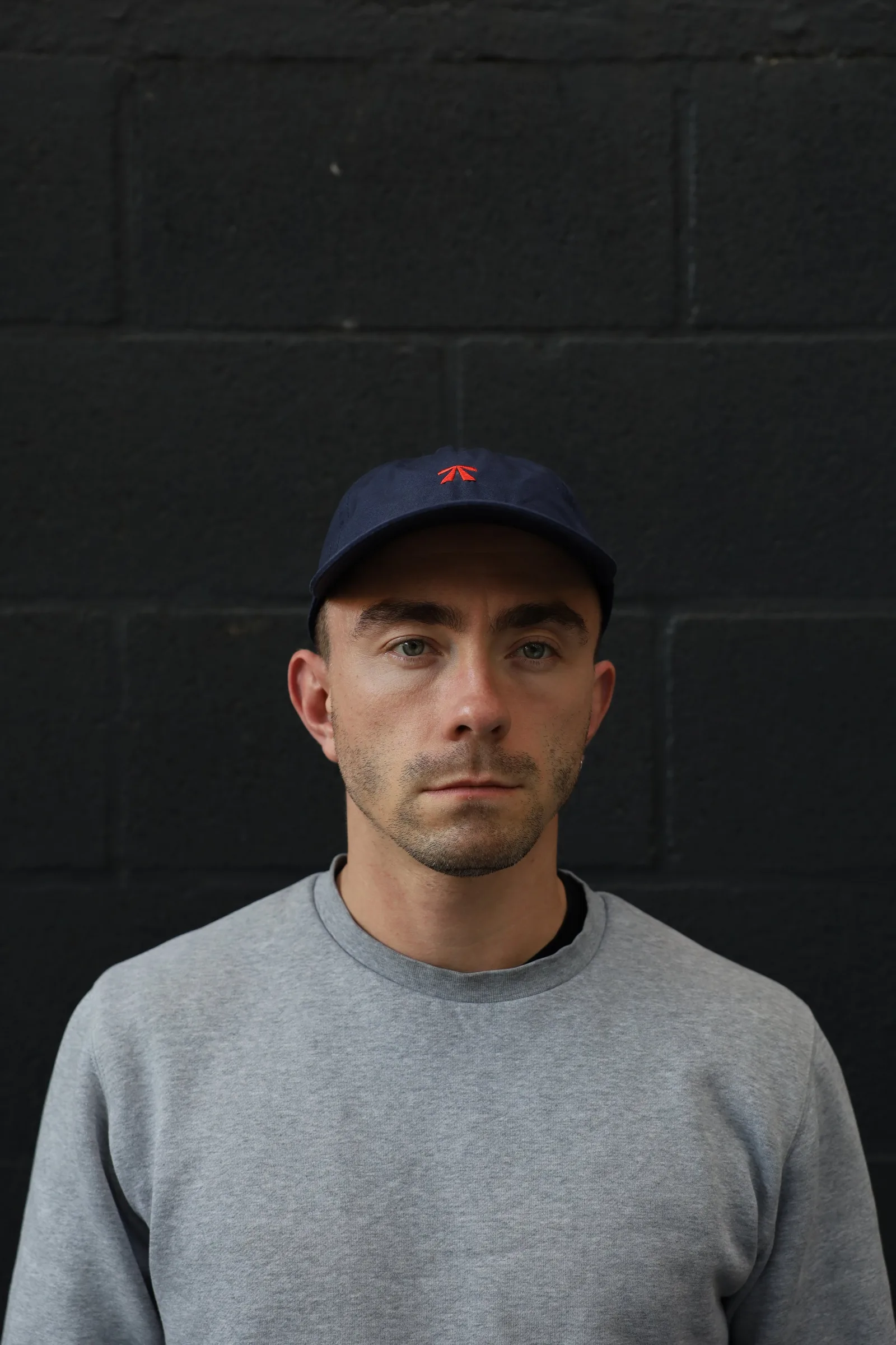 The RB Dad Cap by Roadbloc, in black and white or navy and orange
