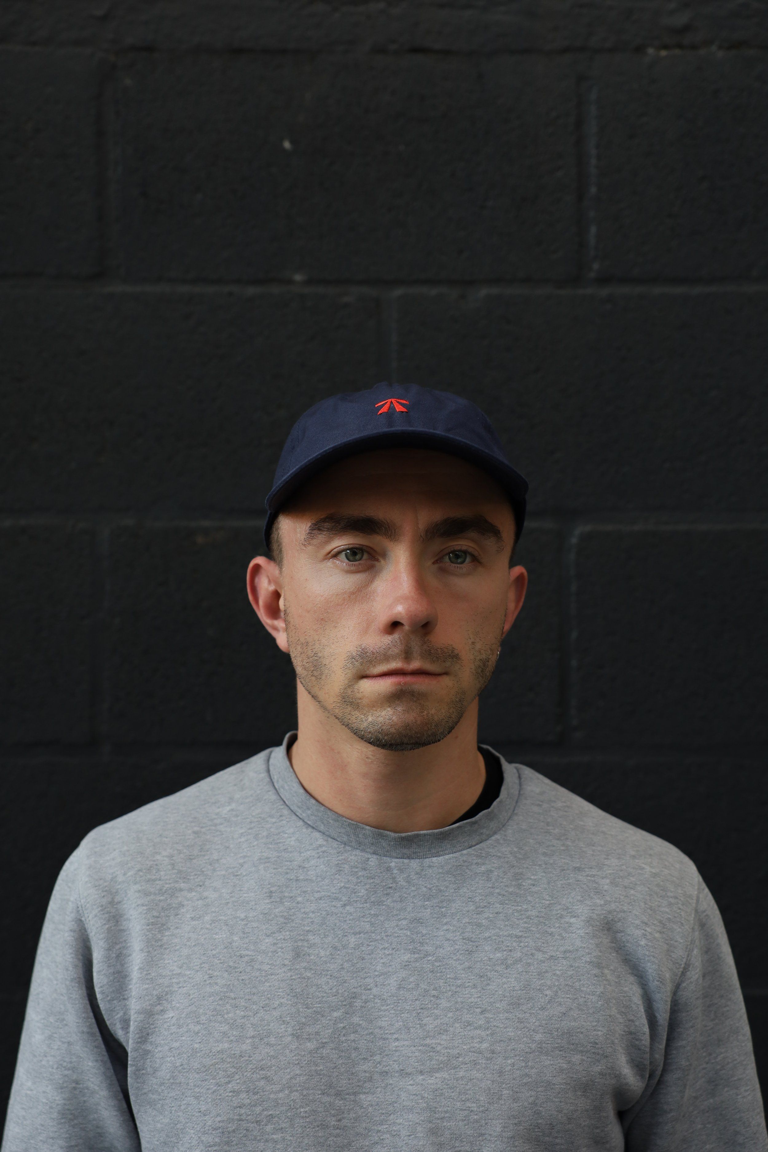 The RB Dad Cap by Roadbloc, in black and white or navy and orange