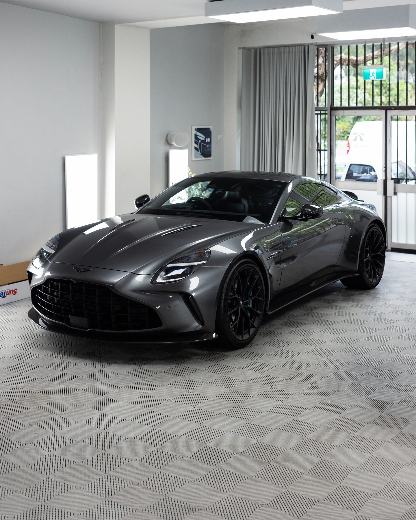 The Vantage S's glasshouse, tinted, against the studio's daylight