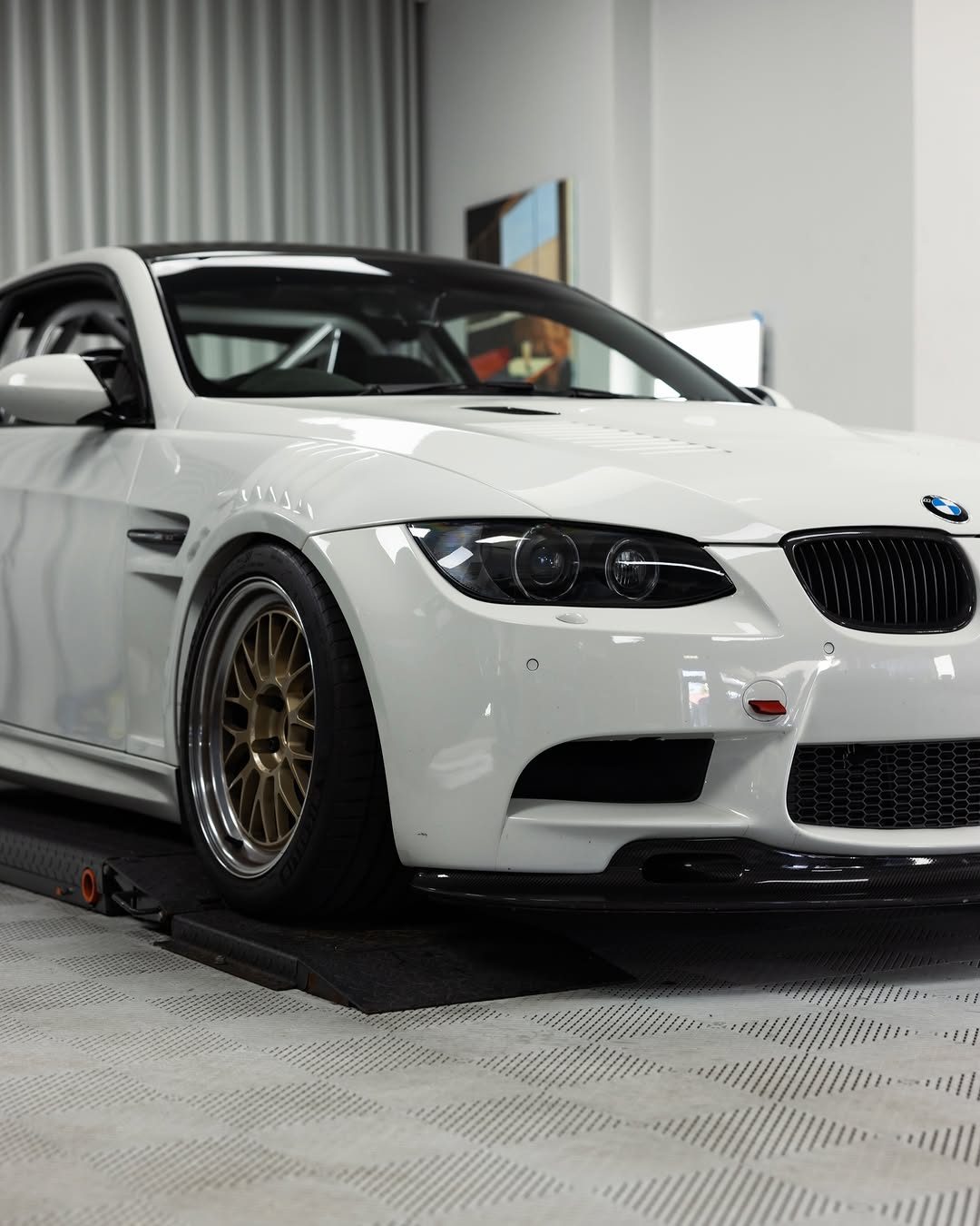 The E92 M3's headlight with satin black internals behind a new lens