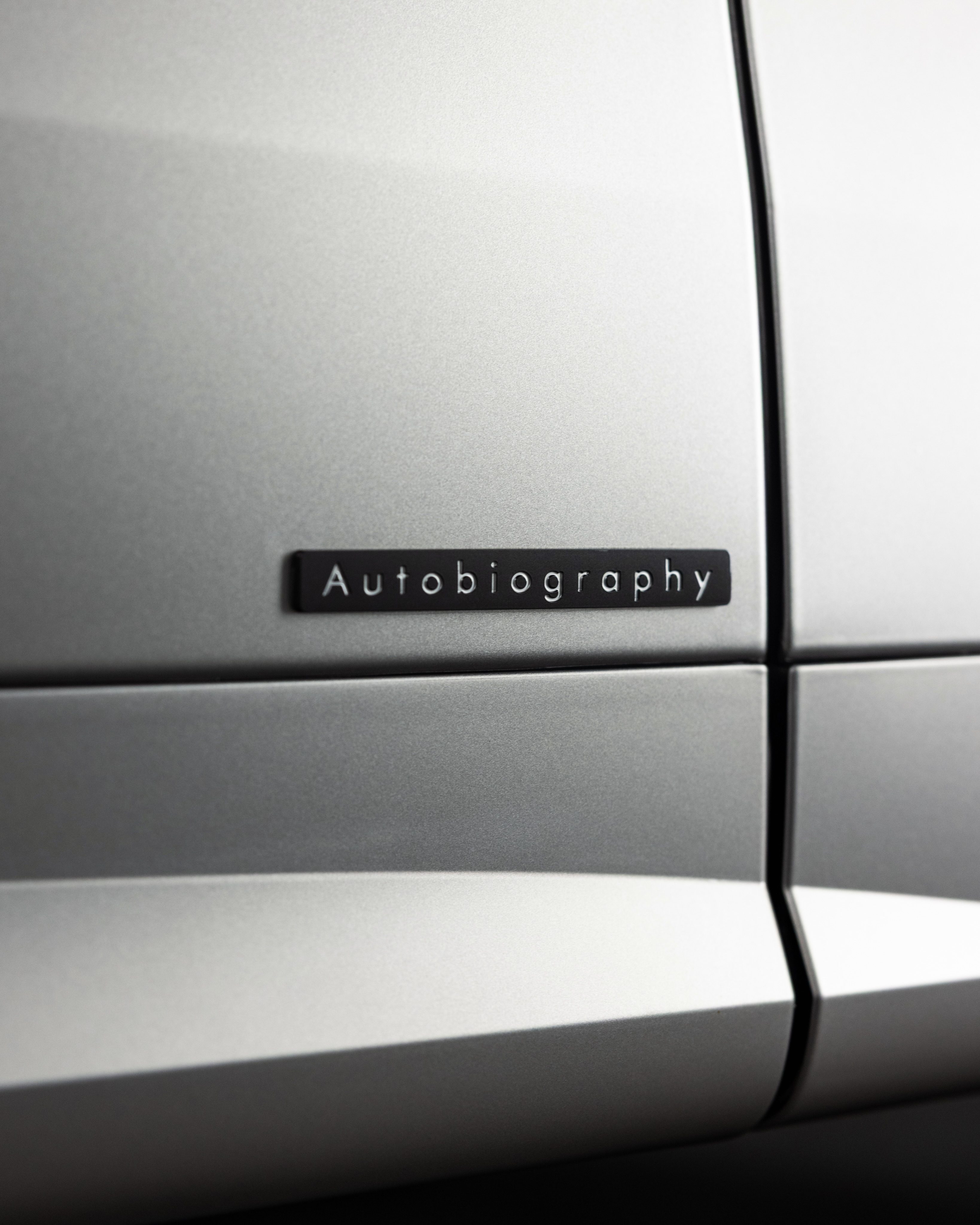 The Range Rover's matte flank under matte film, with the Autobiography badge