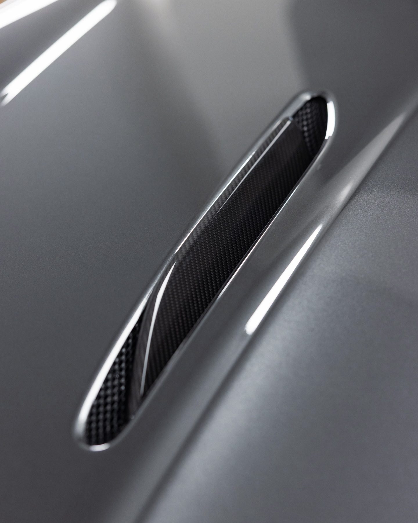 Film carried over the lip of the Vantage S's carbon vent, in one continuous edge