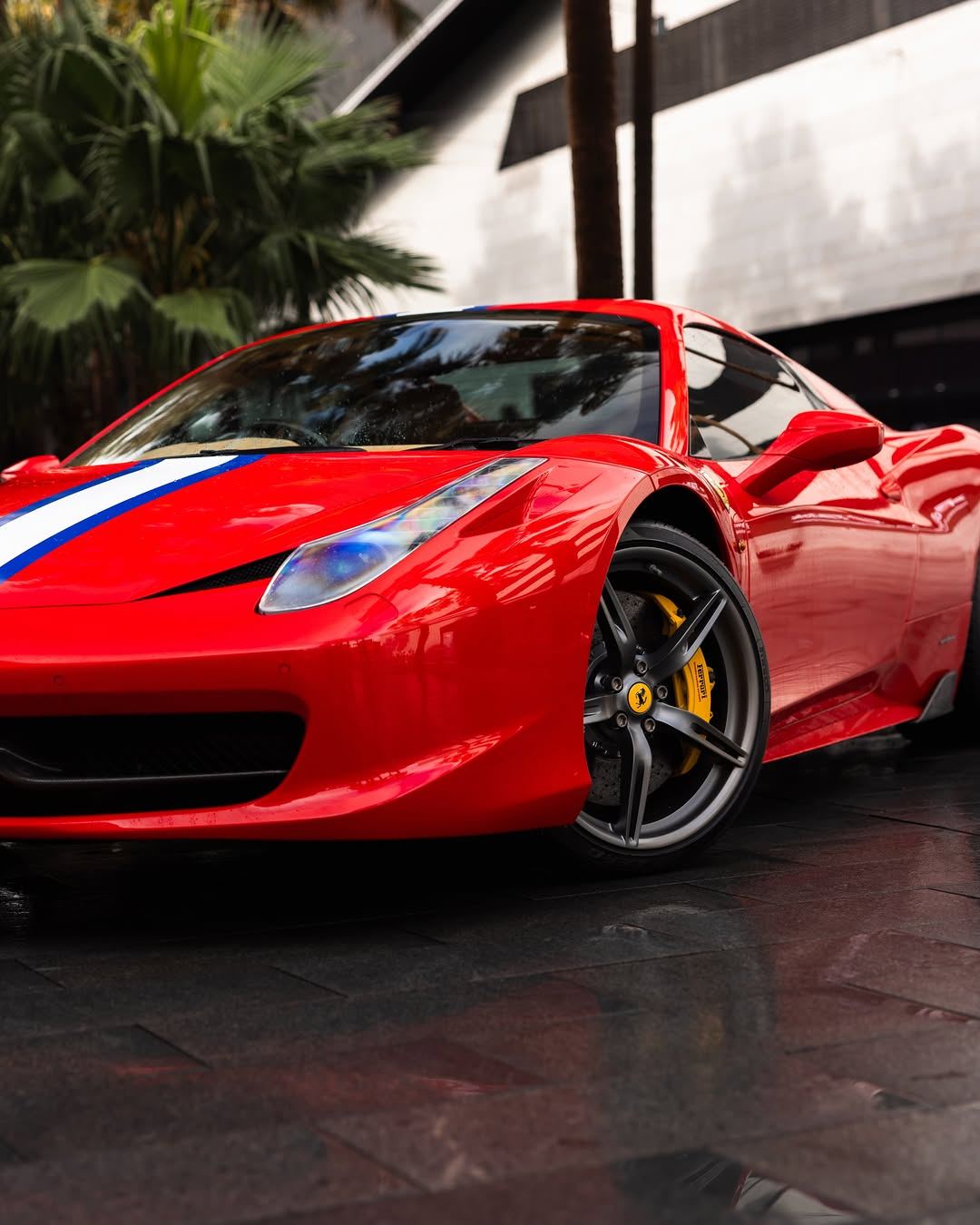 Red Ferrari 458 Spider with a tricolore stripe, front three-quarter view
