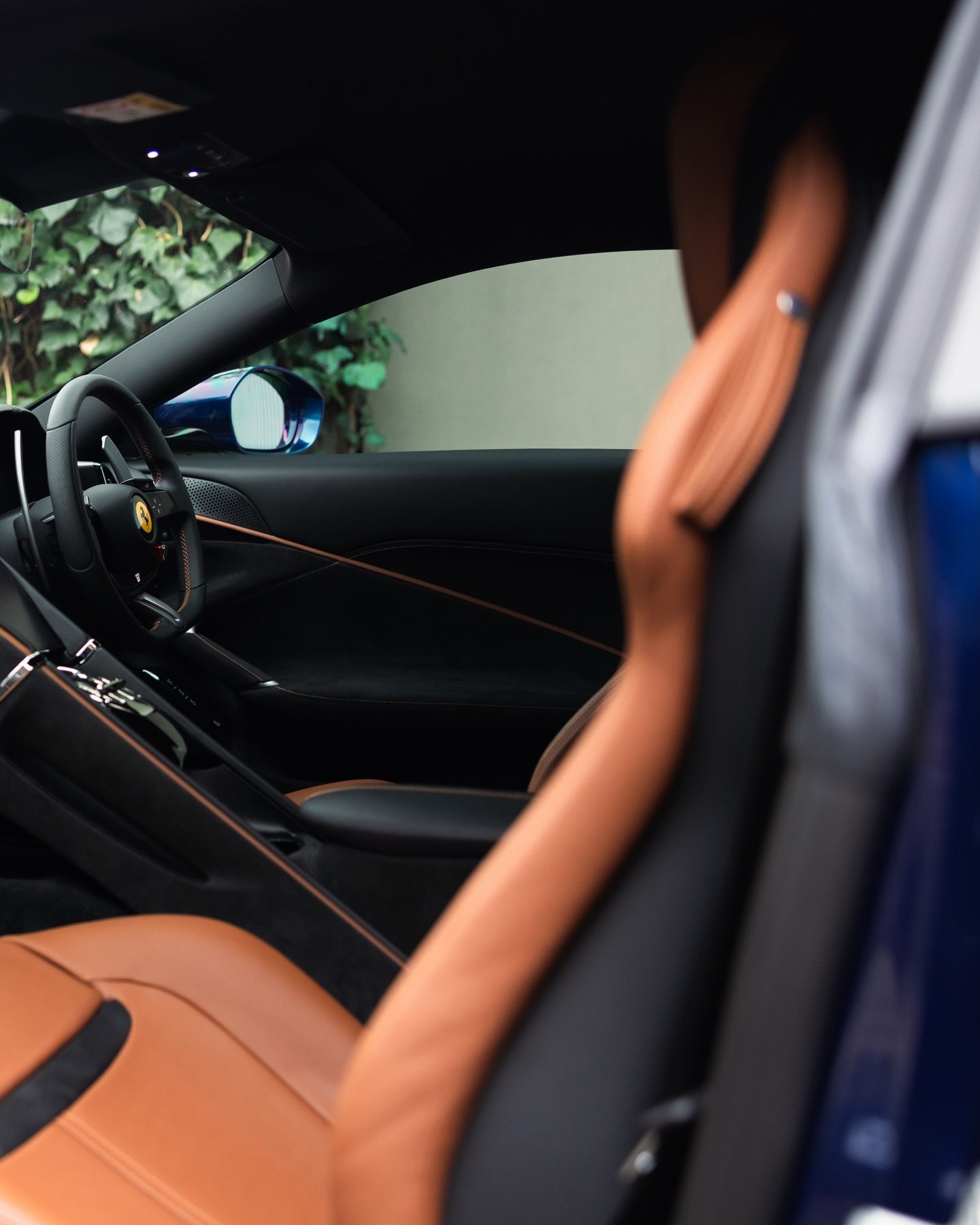 The Roma's tan leather seat and stitched dash