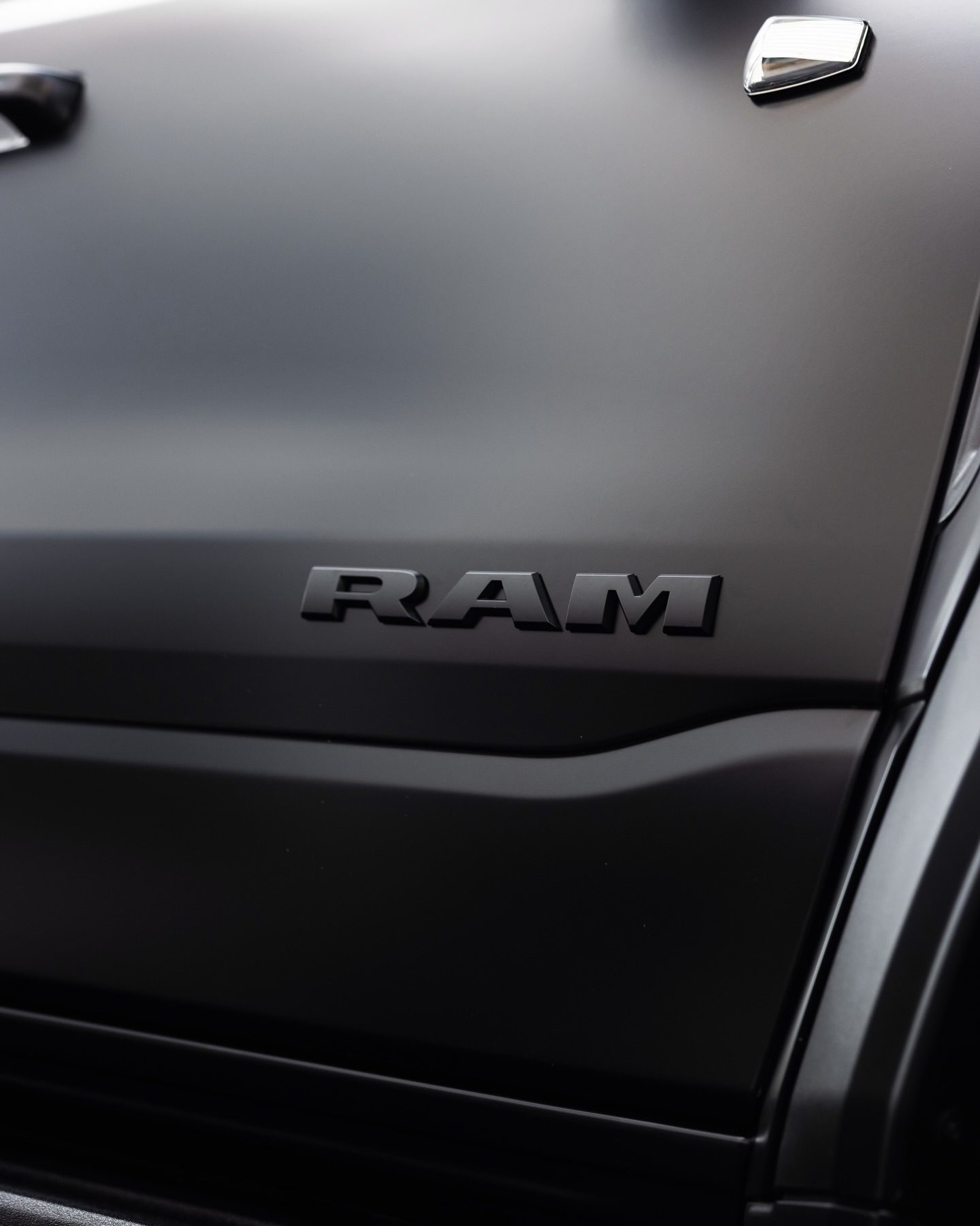 The TRX's satin door beside its gloss black trim and chrome marker