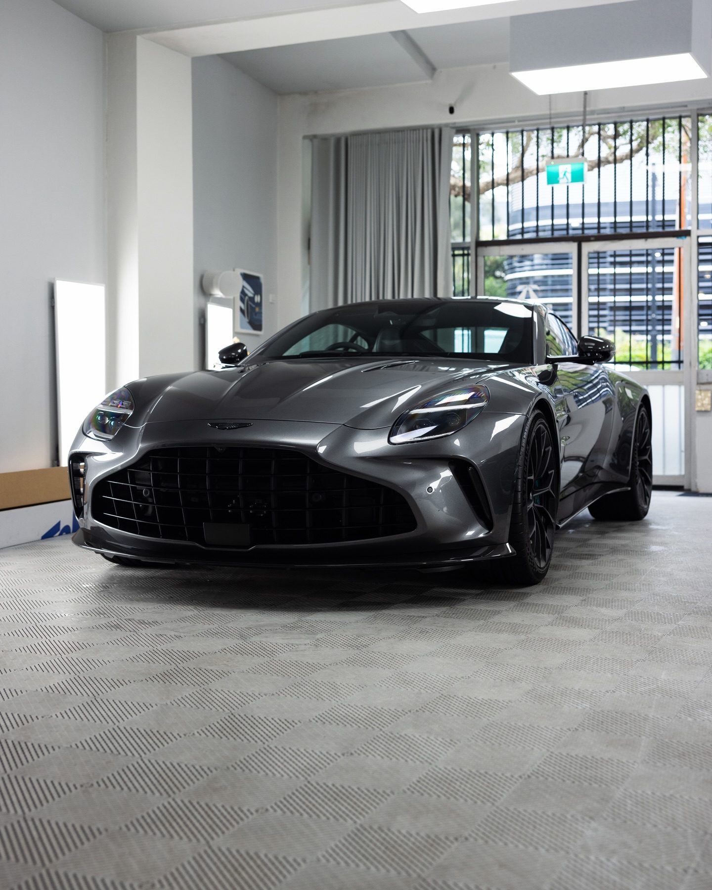 Magnetic Silver Aston Martin Vantage S head on in the Roadbloc studio
