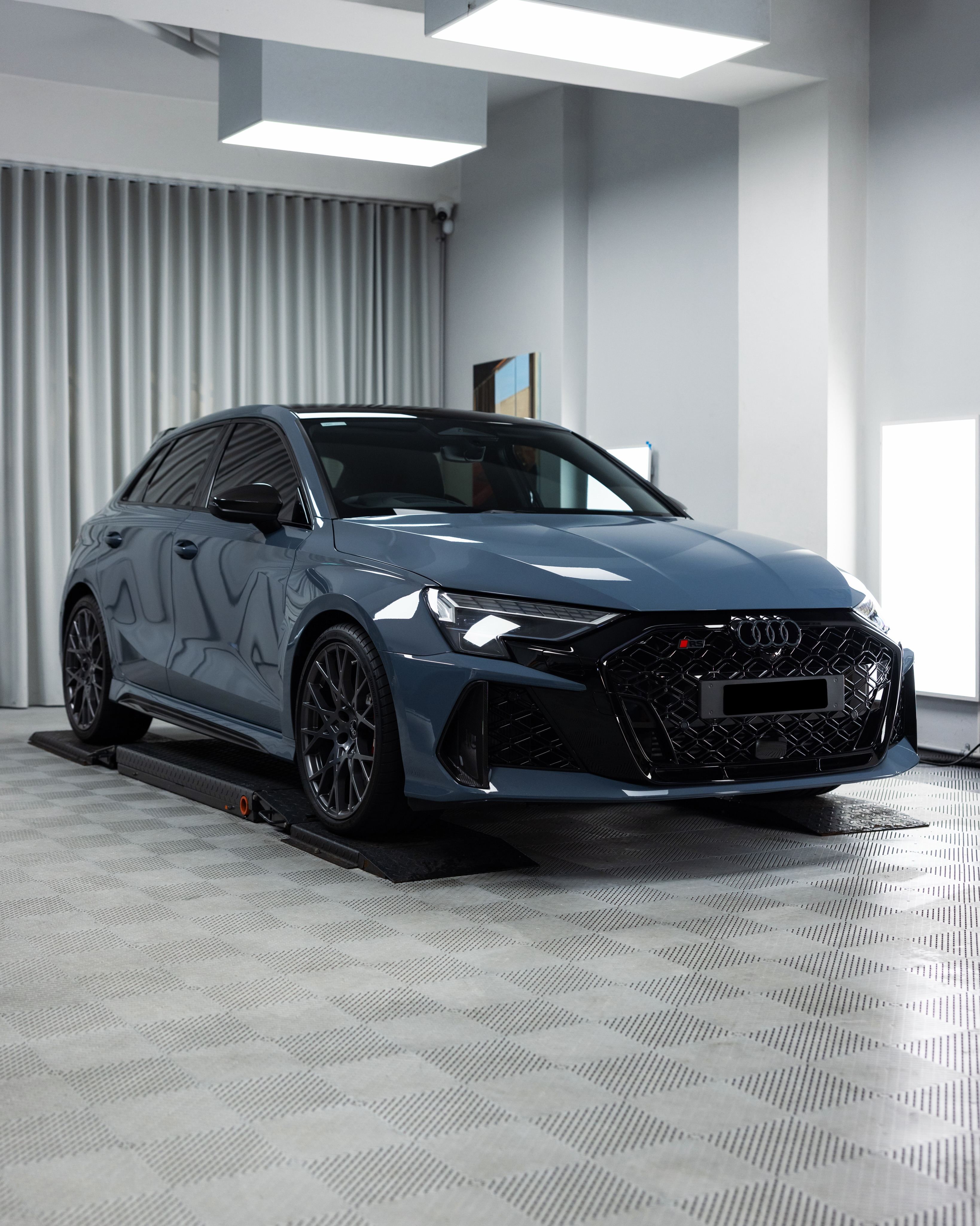 Grey Audi RS3 in the Roadbloc studio, front three-quarter view